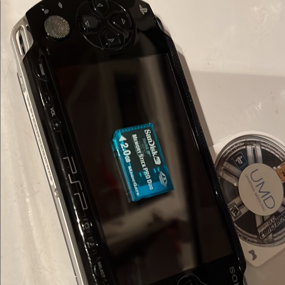 PSP gaming device with midnight club game, memory card and car charger